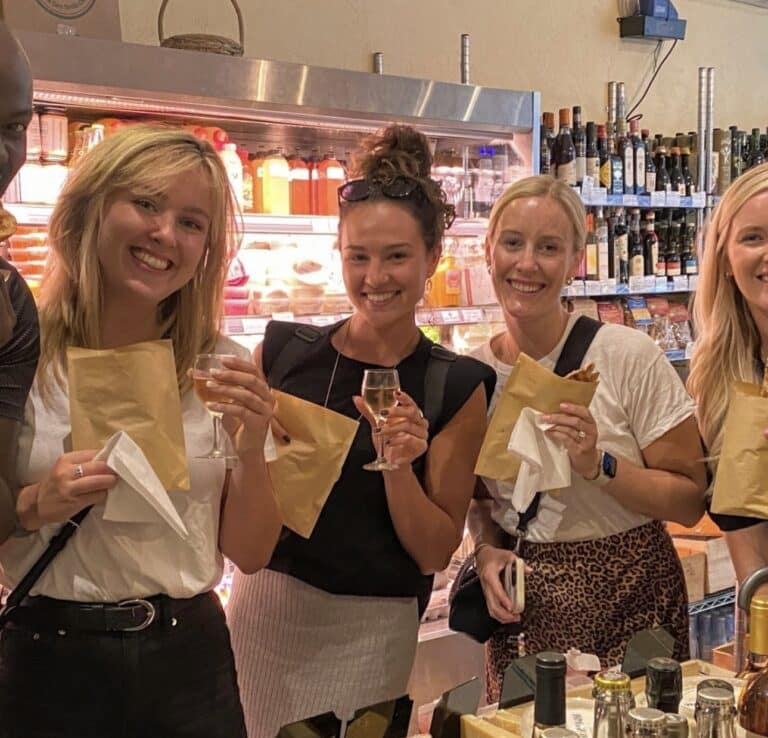 Guests on the South End food tour of Boston pose with their wine