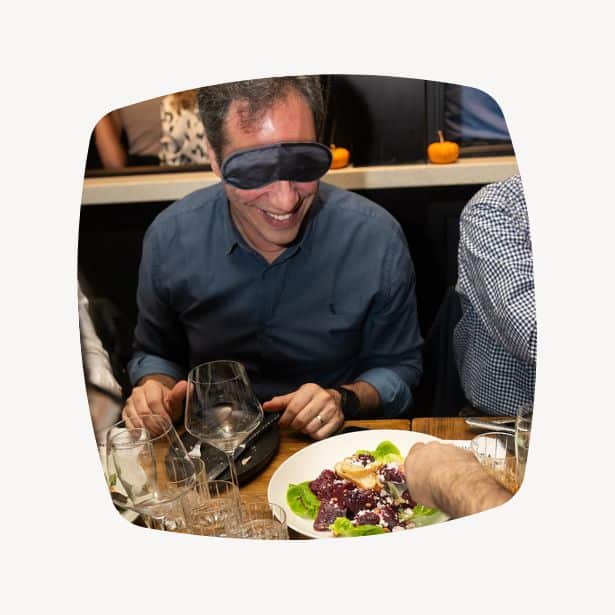 man dining in dark during sensory dinner