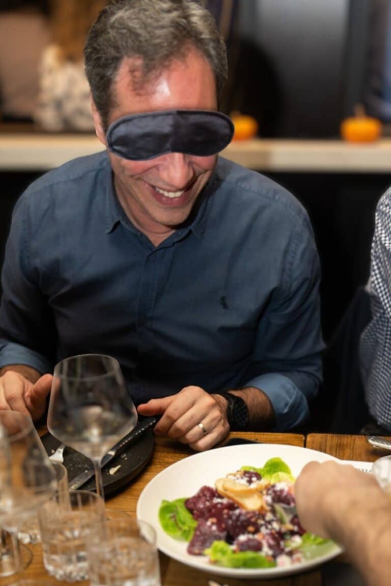 man eating dining in the dark style during avitals sensory dinner