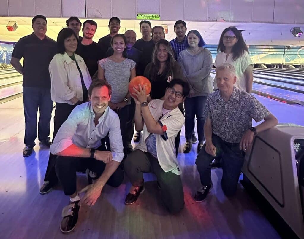 A team poses triumphantly after a few rounds at Homesteafd Bowl and Bar