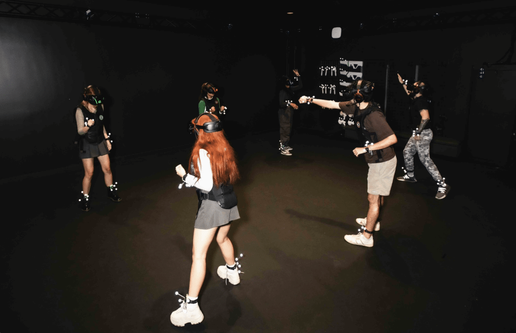 Team members take on virtual challenges at Sandbox VR