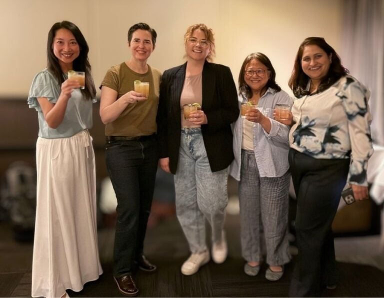 group posing for picture during happy hour event