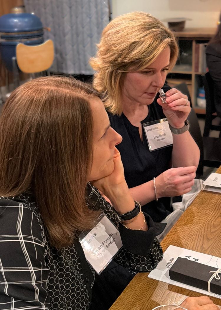 woman smelling like a somm during sensory dinner