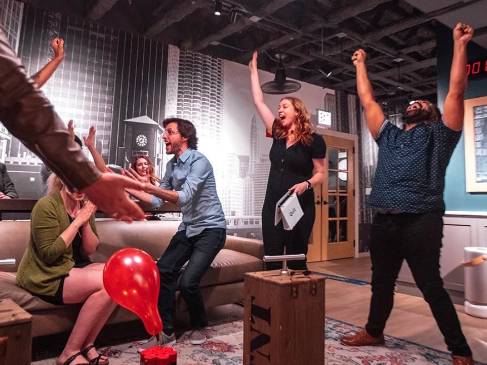 A team celebrates winning at Game Night Out
