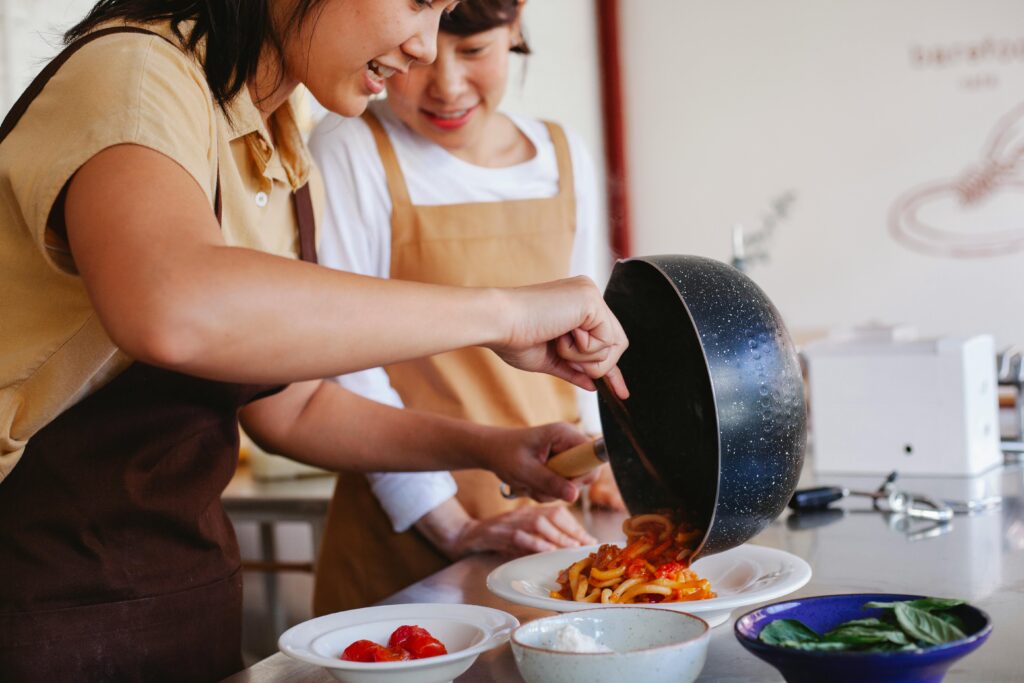 Two women enjoy a cooking class