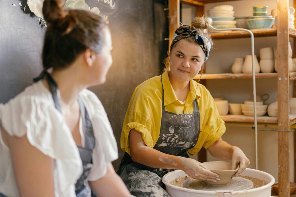 Tem members enjoy learning pottery together