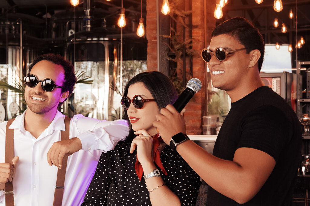 Team members rock out at karaoke