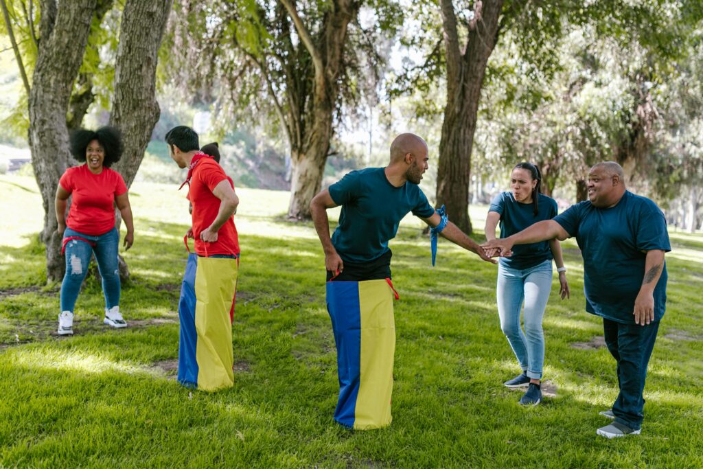 Team members cheer each other on while they participate in the office olympic