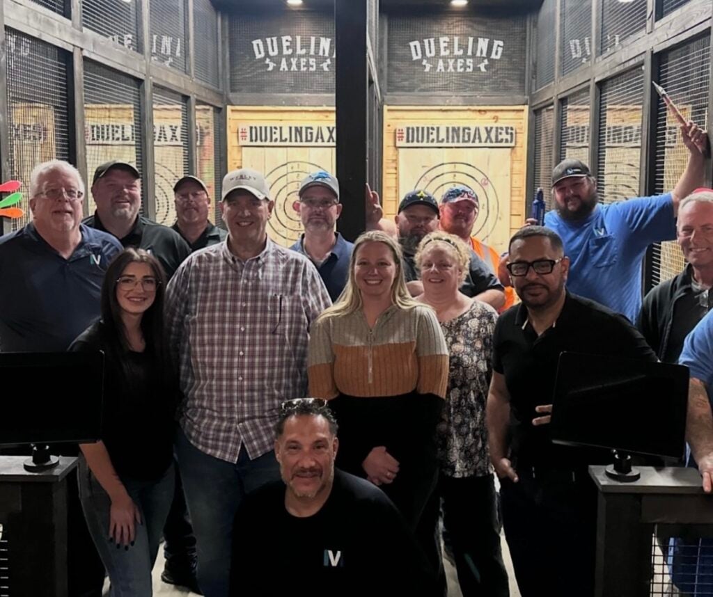 Coworkers pose after a fun night out at Dueling Axes in Las Vegas