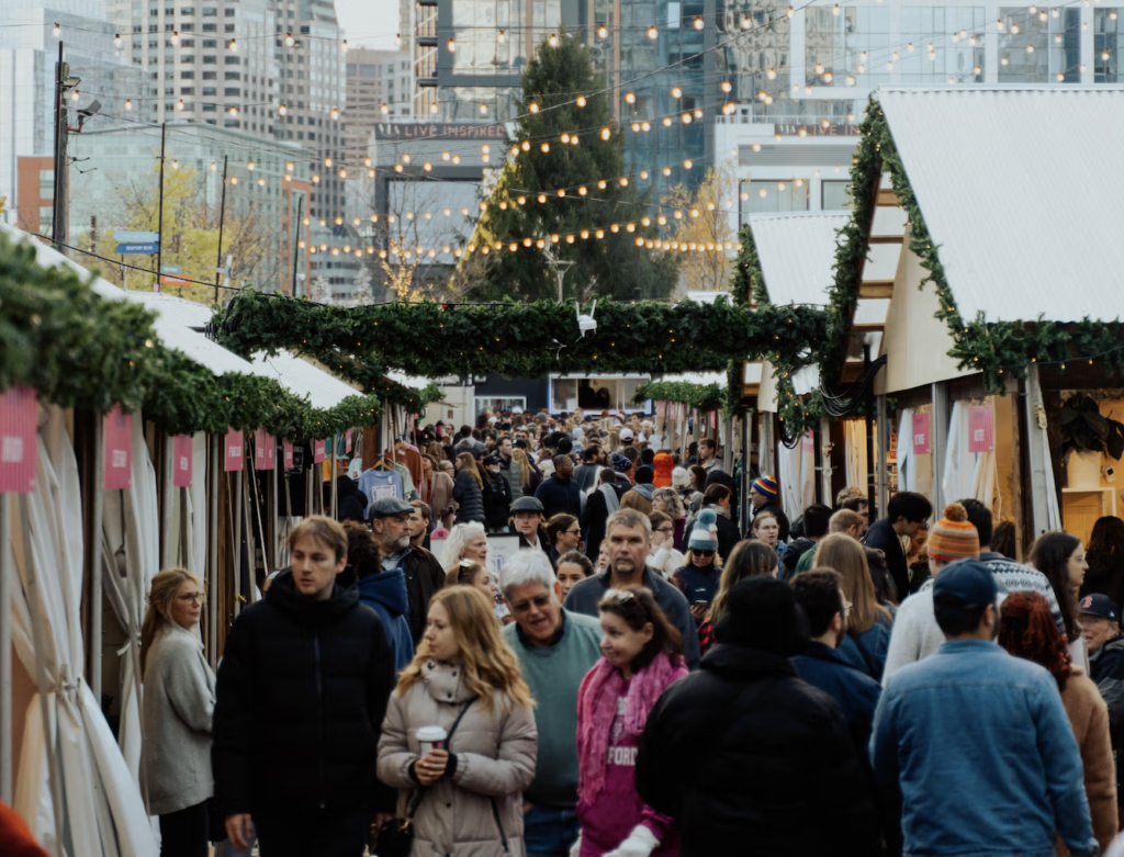 People peruse the shops at Bostons Winter Holiday Market at the Seaport