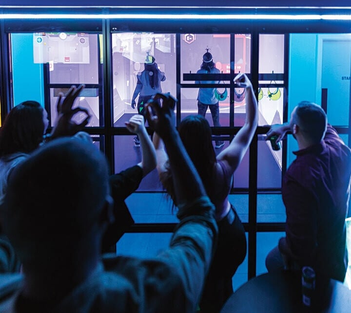 Team members cheer each other on at Immersive Gamebox