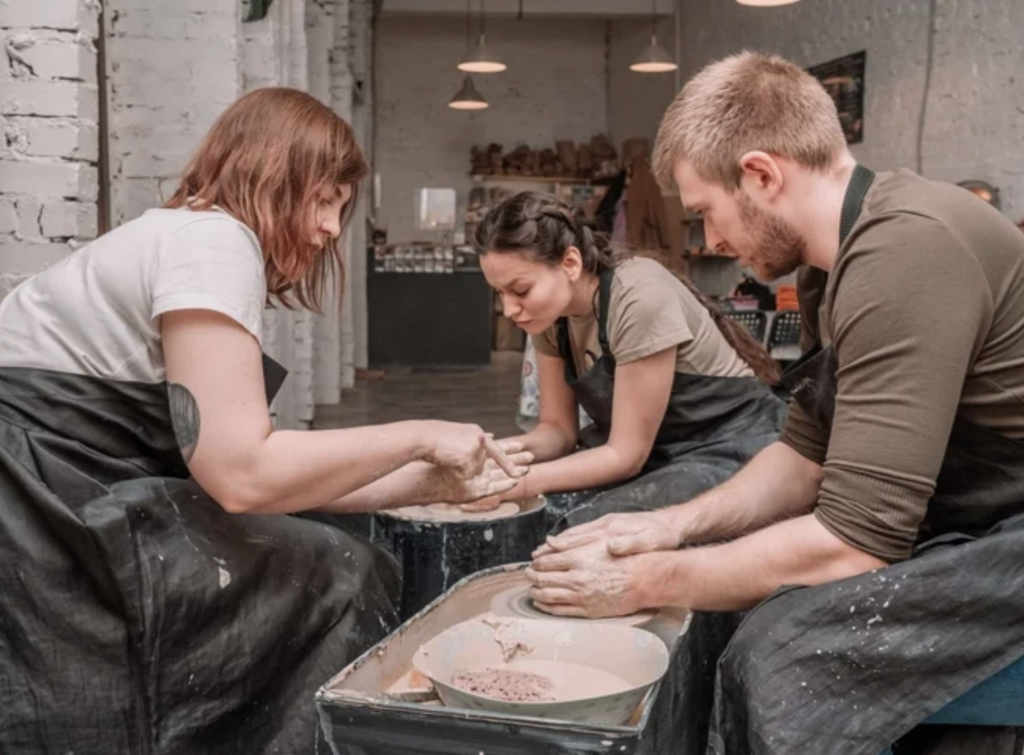 Team members learn a new skill at Pottery Studio 1 in Boston