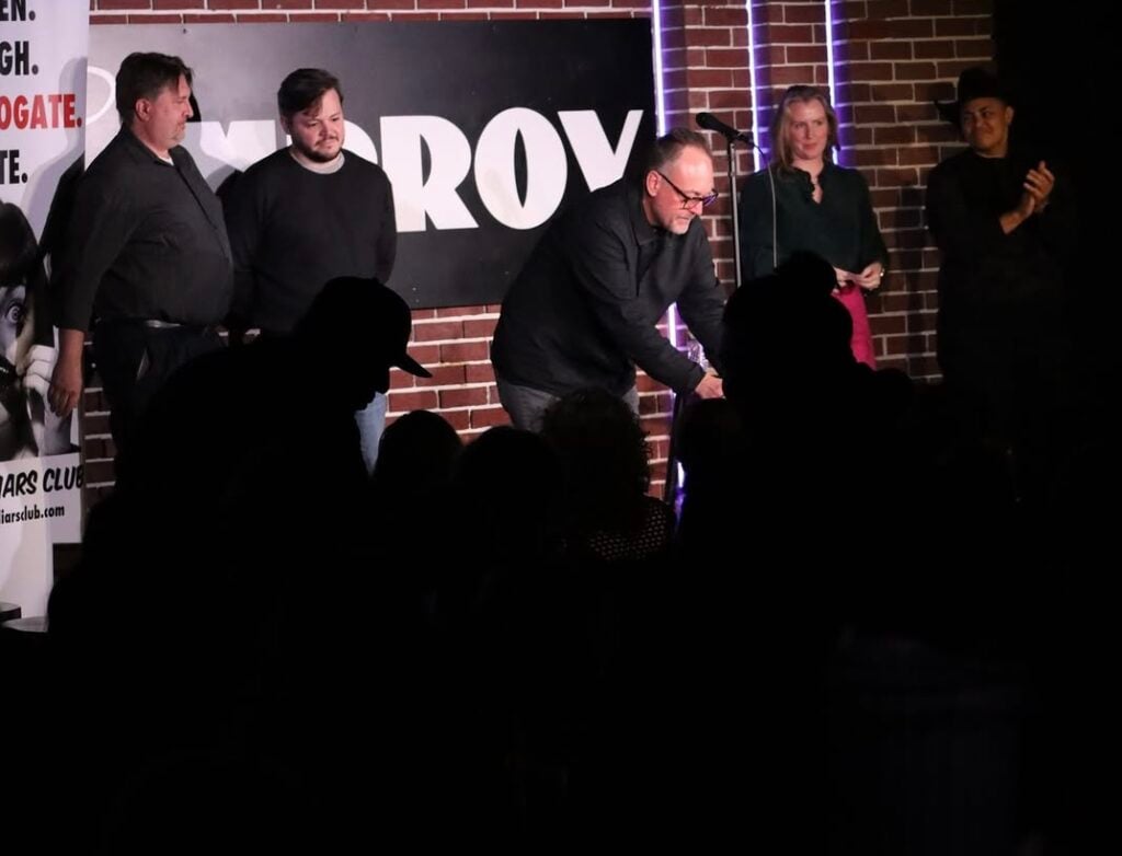 DC Improv performers interact with the audience from the stage