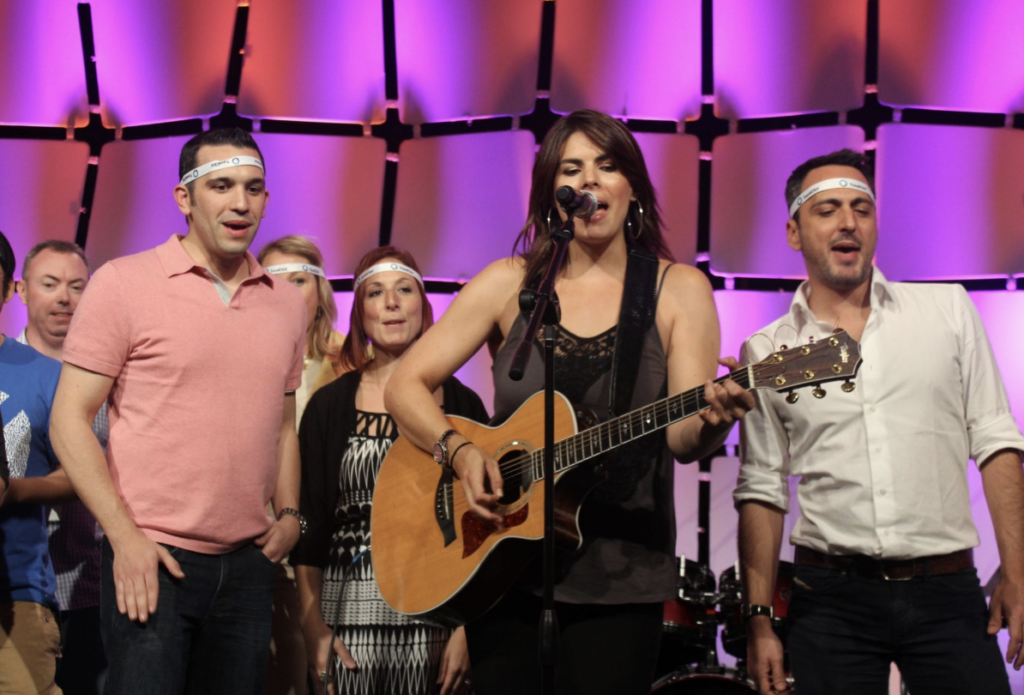 Team members perform an original song made with Kid Billy Music