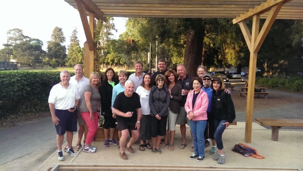 A big team poses at a Burlingame rec facility after playing bocce ball