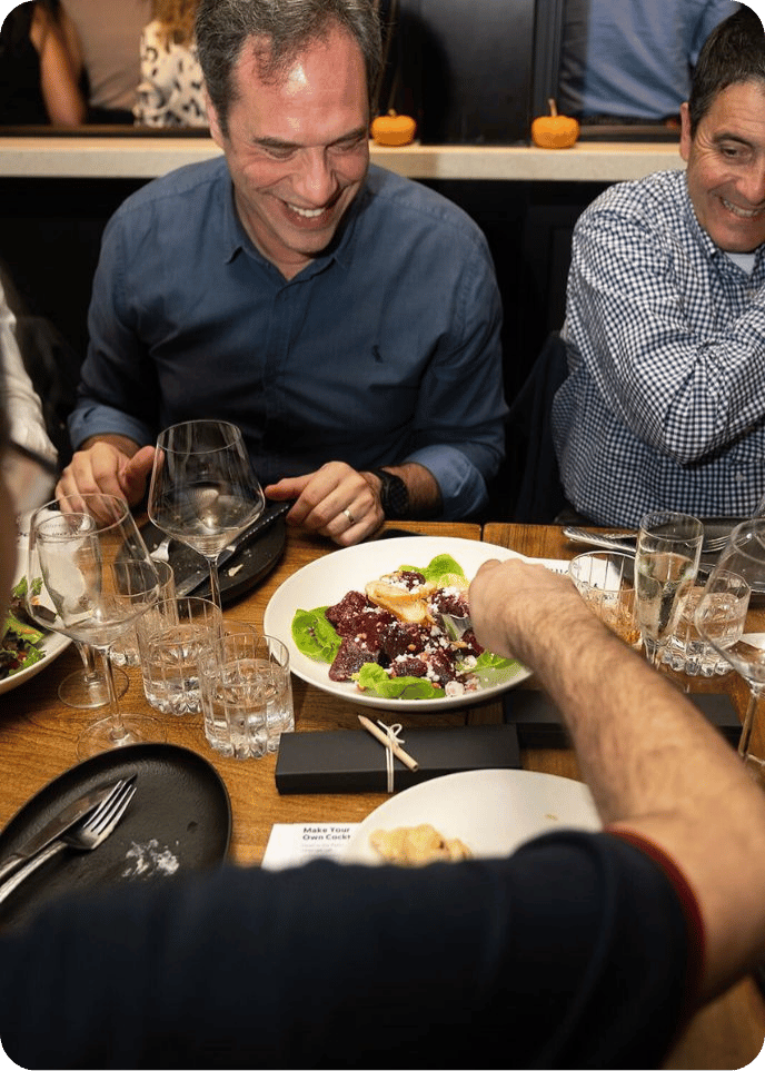 man smiling during interactive meal with avital