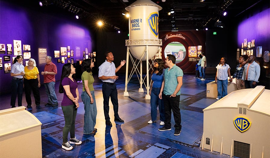 A guide shows team members the Warner bros water tower
