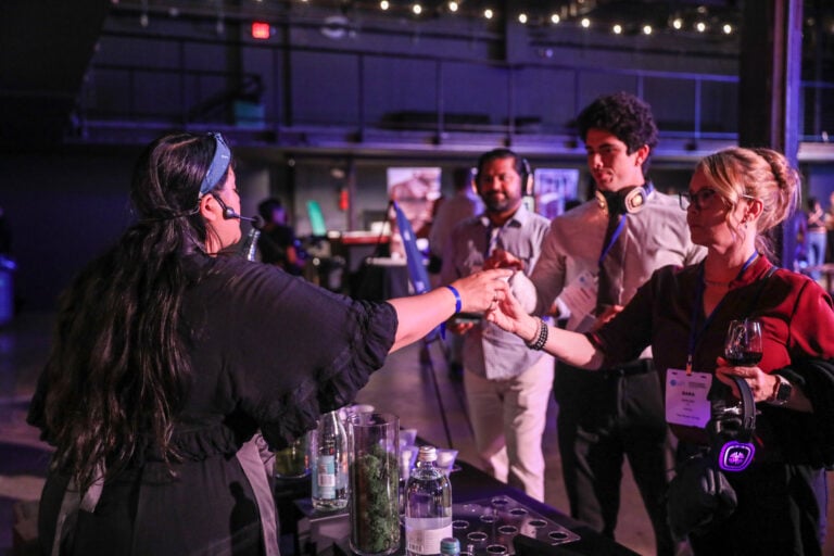 nikki serving water at mpi water tasting bar
