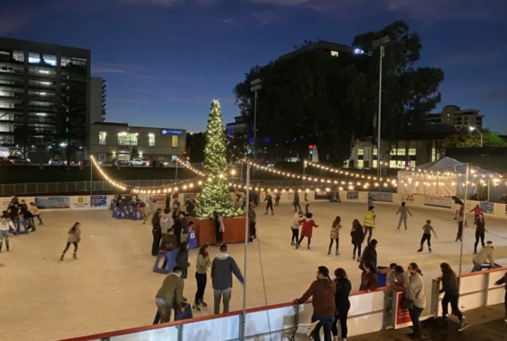 People skate around on the ice