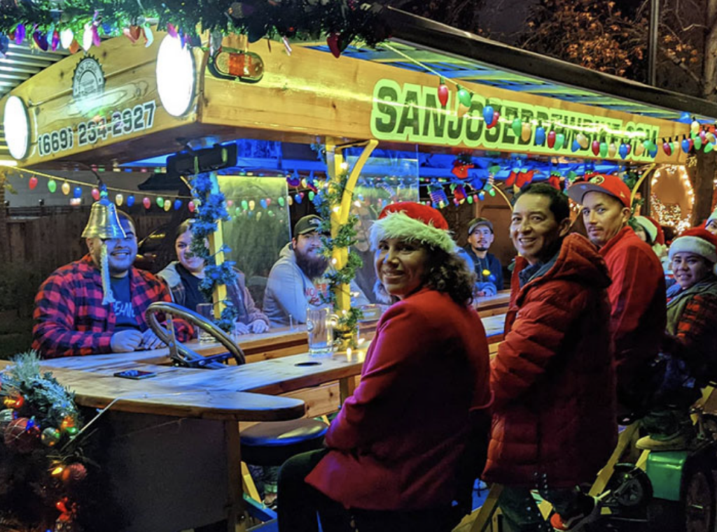 Everyone on a festive brew bike tour in SJ is smiling