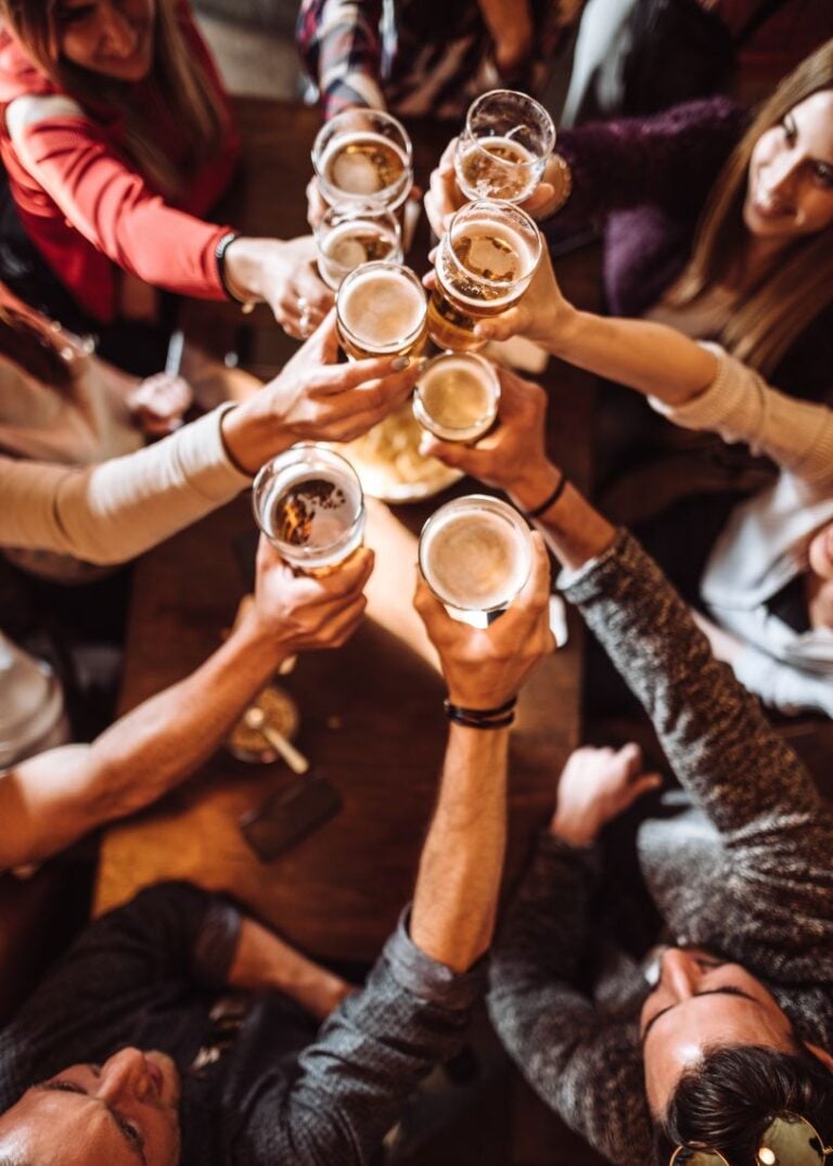 group toasting beers during interactive mingling hour
