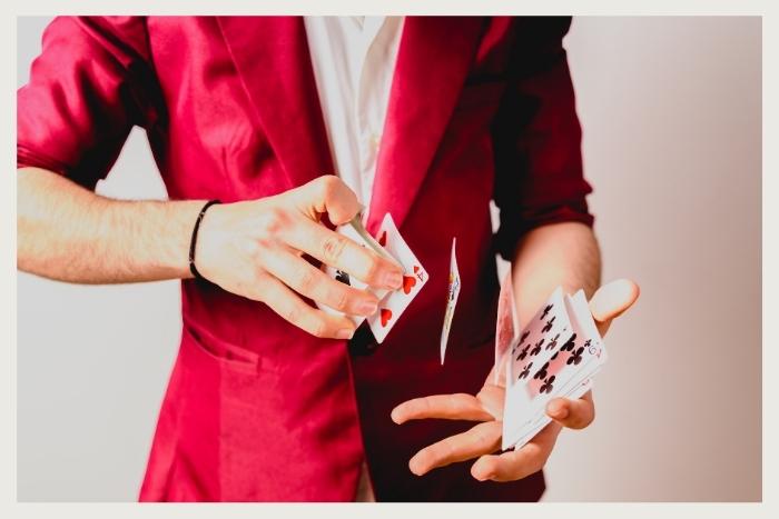 man doing a card trick during unique virtual event