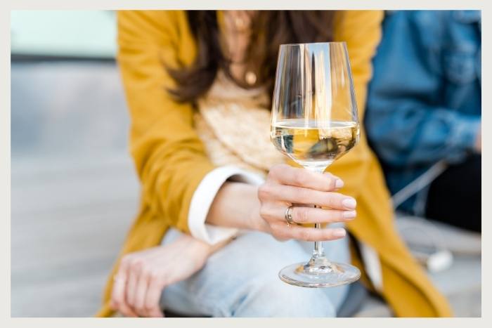 woman drinking water during unique virtual event