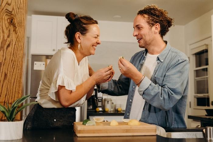 two people laughing during virtual happy hour