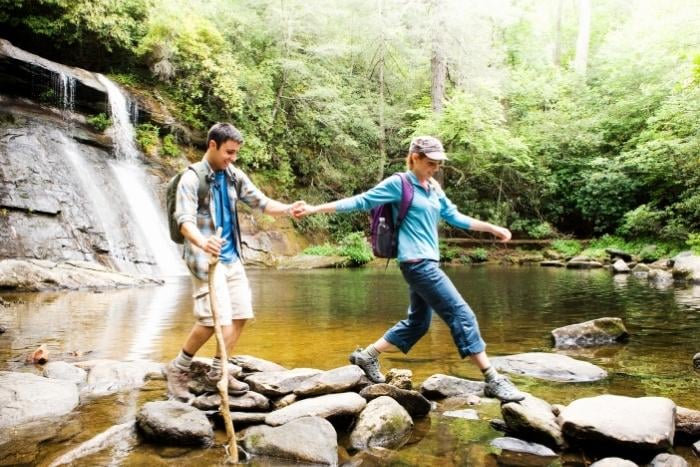 couple-hiking-with-state-park-pass
